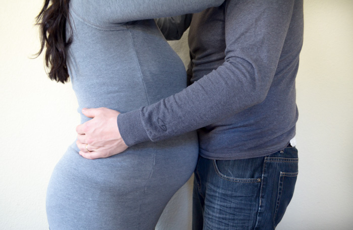 pregnancy photos pregnant couple unique black and white artistic cute couple christmas winter tree light 