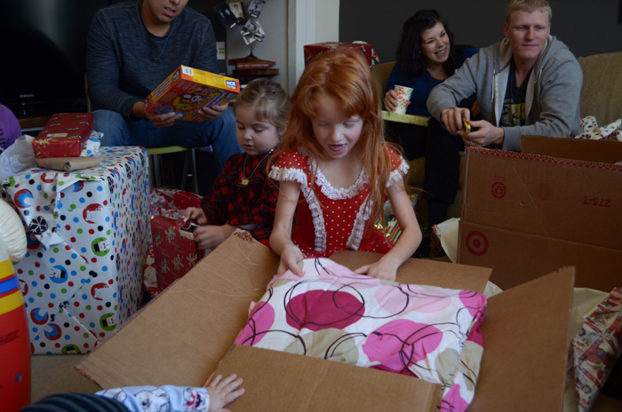Our Christmas Eve and Christmas morning family traditions fun unwrapping gifts love